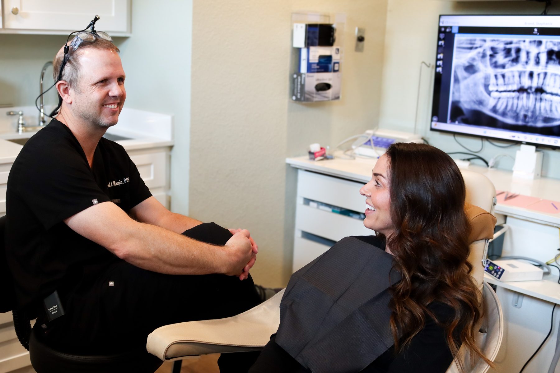Dr. Maupin talking through treatment with a patient